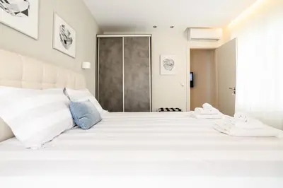 a white bedroom with a large white bed at A15 Premium appartment up to 4ppl next to Parthenon! in Athens