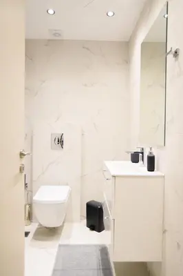 a white bathroom with a toilet and a sink at A15 Premium appartment up to 4ppl next to Parthenon! in Athens
