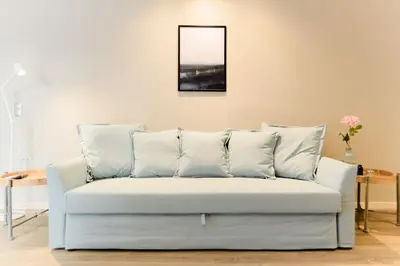 a white couch with pillows in a living room at A15 Premium appartment up to 4ppl next to Parthenon! in Athens