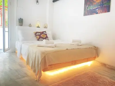 a bedroom with a bed with two towels on it at Thisio Loft in Athens