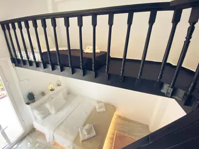a room with a bath tub on a staircase at Thisio Loft in Athens