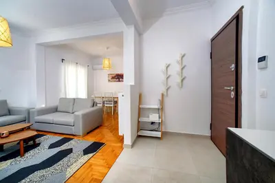 a living room with a couch and a table at Acropolis area family friendly 2bdr apartment in Athens