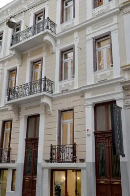 a large white building with balconies on it at 1900 ATHENIAN HOUSE in Athens