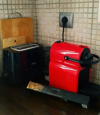 a red suitcase sitting on top of a table at Emily`s vacation house in Kalívia Thorikoú