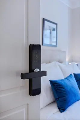 a bed with a black shelf next to a blue pillow at Classic Hotel by Athens Prime Hotels in Athens