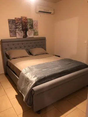 a bedroom with a bed in a room at Filoxenia Apartment in Athens