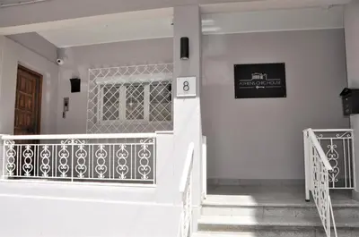 a staircase leading to the front door of a house at Athens Chic House in Athens