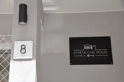 a sign on a door of an athensswick house at Athens Chic House in Athens