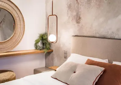 a bedroom with a bed and a mirror at Tree Olive Athens in Athens