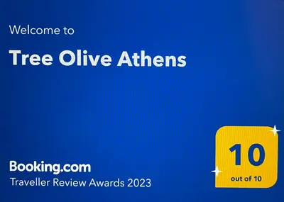 a yellow sign with the words tree alive atirs at Tree Olive Athens in Athens