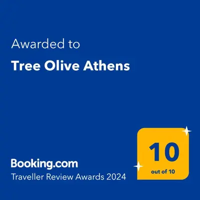 a yellow sign that says awarded to tree online atirs at Tree Olive Athens in Athens