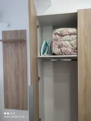 a room with a closet with a bed and a shelf at Studio in the heart of Athens !!! in Athens
