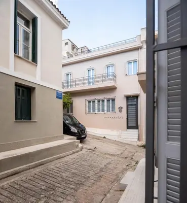 a car parked in front of a building at THIRAMENOUS RESIDENCE in Athens