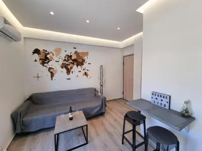 a bedroom with a bed and a table and chairs at WOW Penthouse Boutique in the heart of Historical Center in Athens