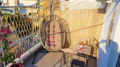 a bed sitting on a balcony on a balcony gmaxwell gmaxwell gmaxwell gmaxwell gmaxwell at WOW Penthouse Boutique in the heart of Historical Center in Athens
