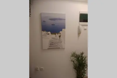 a picture hanging on a wall in a room at Kolonaki. Luxurious Studio in Athens