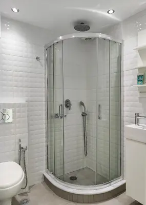 a bathroom with a shower with a toilet and a sink at KYMA Apartments Athens 19 in Athens