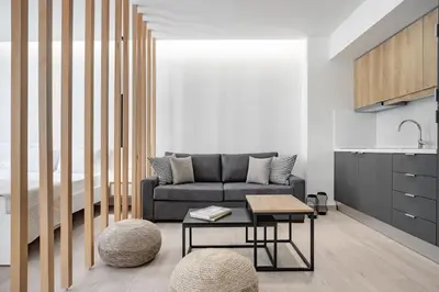 a living room with a couch and a table at Central Boutique Apartment A2 in Athens