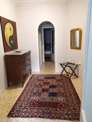 a room with a dresser and a rug on the floor at Lovely apartment in Plaka in Athens
