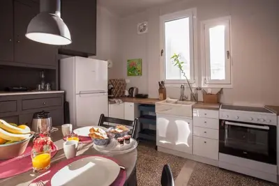 a kitchen with a table with a plate of food on it at Lovely apartment in Plaka in Athens