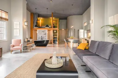 a living room with a couch and a table at Athens Heart Superior Loft under Acropolis in Athens