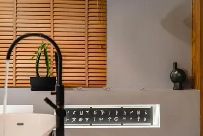 a bathroom with a sink and a window with a cactus at Athens Heart Superior Loft under Acropolis in Athens