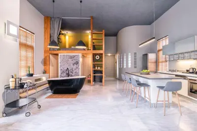 a kitchen with a tub and a table and chairs at Athens Heart Superior Loft under Acropolis in Athens