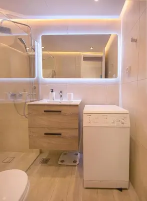 a bathroom with a sink and a toilet and a mirror at Del Mar Luxury Apartment 30m From The Beach in Porto Rafti