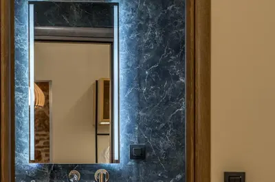 a bathroom with a mirror and a sink at Philia Boutique Hotel in Athens