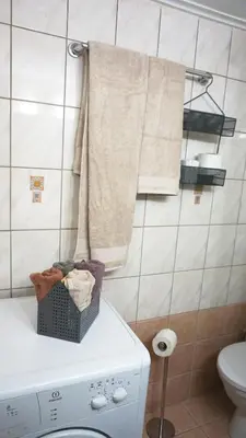a laundry room with a washing machine and a towel at A few steps away from Syntagma and Plaka by Athenian Homes in Athens