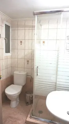 a bathroom with a toilet and a shower and a sink at A few steps away from Syntagma and Plaka by Athenian Homes in Athens