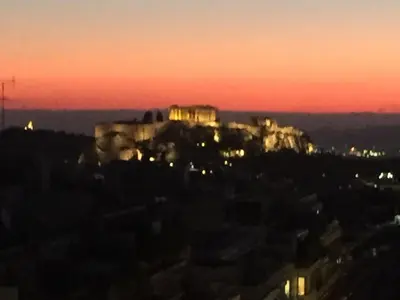 a view of the acropolis at sunset at kolonaki Penthouse panoramic Acropolis view in Athens