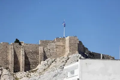 a castle with a flag on top of it at Downtown Cocoon with Roof Deck in Athens
