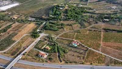 an aerial view of a house and a road at Villa Evinoi in Pallíni