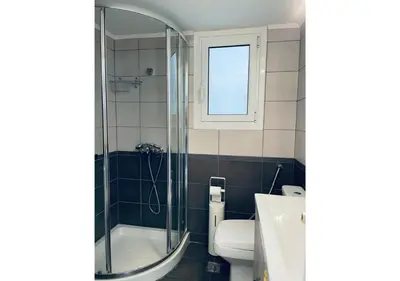 a bathroom with a shower and a toilet and a sink at Cozy Apartment in Central Athens - Sleeps 6 in Athens