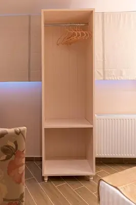 a cupboard with a hanger in a room at IPELHOME - Rodi Boutique Apartment in Athens