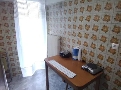 a desk with two phones sitting on top of it at Studio in Athens in Athens