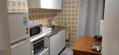 a small kitchen with a sink and a refrigerator at Studio in Athens in Athens
