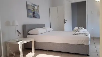 a bedroom with a bed with two stuffed animals on it at Sky Apartment - Athens Center, 5 BD, 4 BATH in Athens