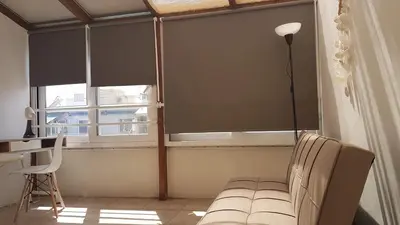 a room with a window with a couch and a desk at Sky Apartment - Athens Center, 5 BD, 4 BATH in Athens