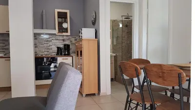 a kitchen and dining room with a table and chairs at Sky Apartment - Athens Center, 5 BD, 4 BATH in Athens