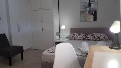 a bedroom with a bed and a desk and a chair at Sky Apartment - Athens Center, 5 BD, 4 BATH in Athens