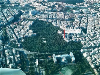 an aerial view of a city with buildings and trees at Cozy Apt in Ilisia with Urban Forest View in Athens