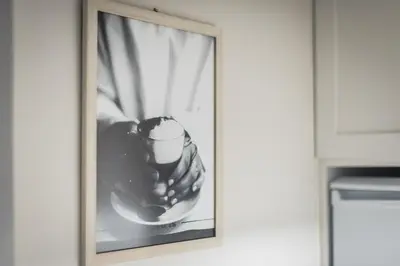 a picture of a hand holding a cup and spoon at Athens F&K Boutique Apartment in Athens