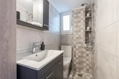 a bathroom with a sink and a toilet at Athens F&K Boutique Apartment in Athens