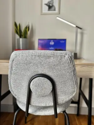 a chair in front of a desk with a laptop at Athens F&K Boutique Apartment in Athens