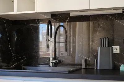 a kitchen with a sink and a counter top at Faliro Lux Apartment By The Sea VIPGreece in Athens