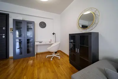 a living room with a desk and a mirror at Faliro Lux Apartment By The Sea VIPGreece in Athens