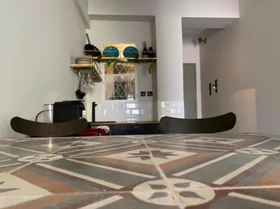 a dining room with a table and two chairs at Mosaics aprtm in Monastiraki with Acropolis view in Athens