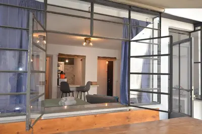 a living room with a large glass window at Studio Mavili in Athens
